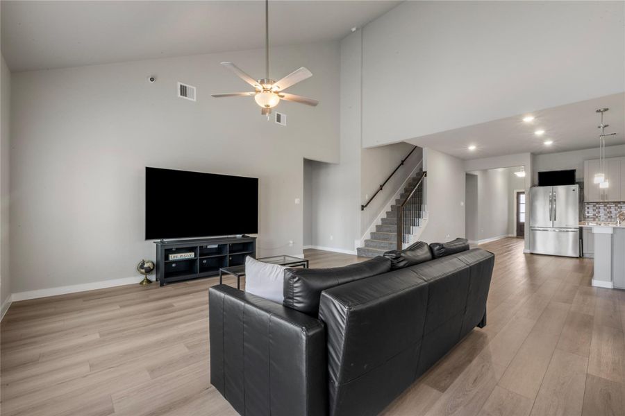 Spacious and light-filled living area designed for comfort and everyday living. The open layout provides ample room for seating and entertainment, with large windows that allow natural light to flow throughout the space.