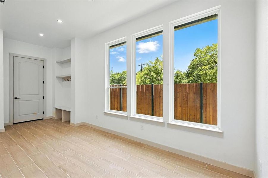 Empty room with recessed lighting and wood tiled floors Empty room with recessed lighting and wood tiled floors