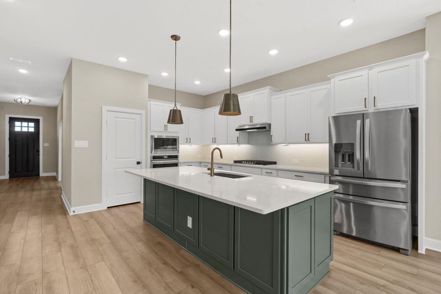 Spacious kitchen with oversized island with breakfast bar