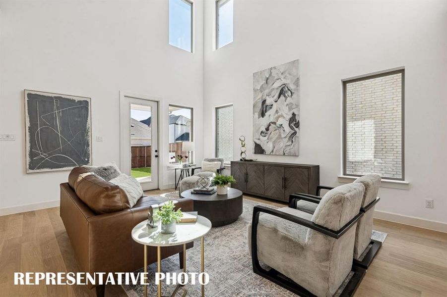 This spacious family room is large enough to host the entire family!  REPRESENTATIVE PHOTO