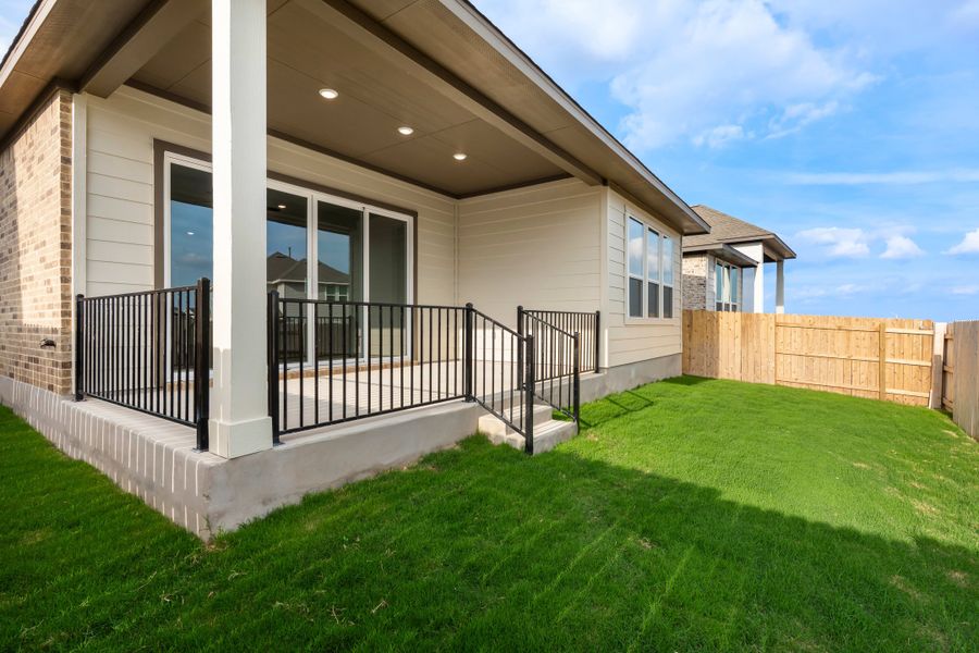 Exterior details and patio area of a home in Lariat, Liberty Hill (Image 27).