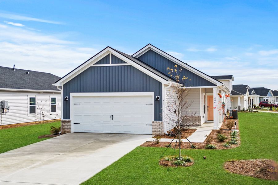 Front exterior of a new home in Waterside, Longs, SC, highlighting curb appeal (Image 1). Front exterior of a new home in Waterside, Longs, SC, highlighting curb appeal (Image 1).