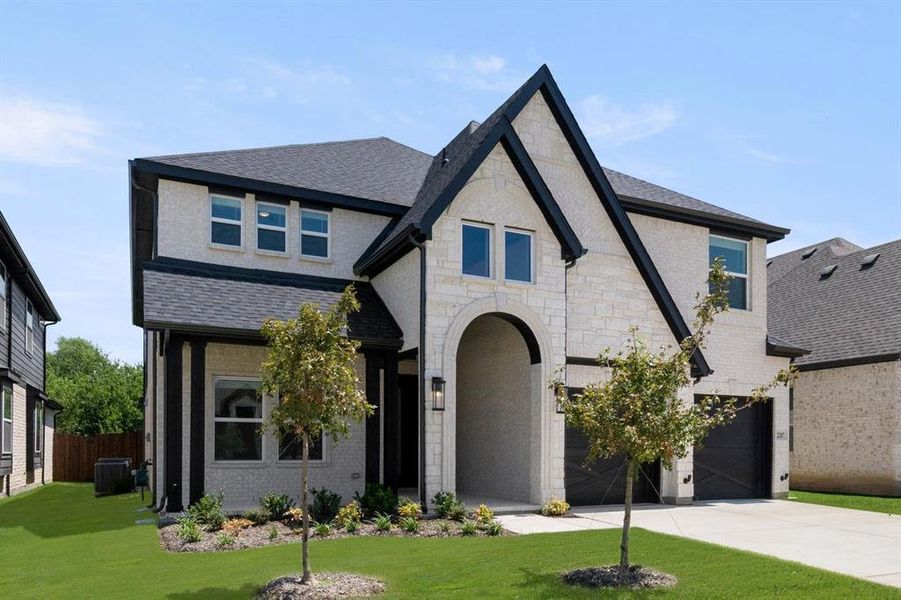 Front exterior of a new home in Birdsong, Mansfield, TX, highlighting curb appeal (Image 2). Front exterior of a new home in Birdsong, Mansfield, TX, highlighting curb appeal (Image 2).