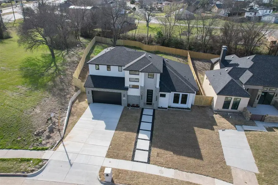 Front exterior of a new home in , Dallas, TX, highlighting curb appeal (Image 25).