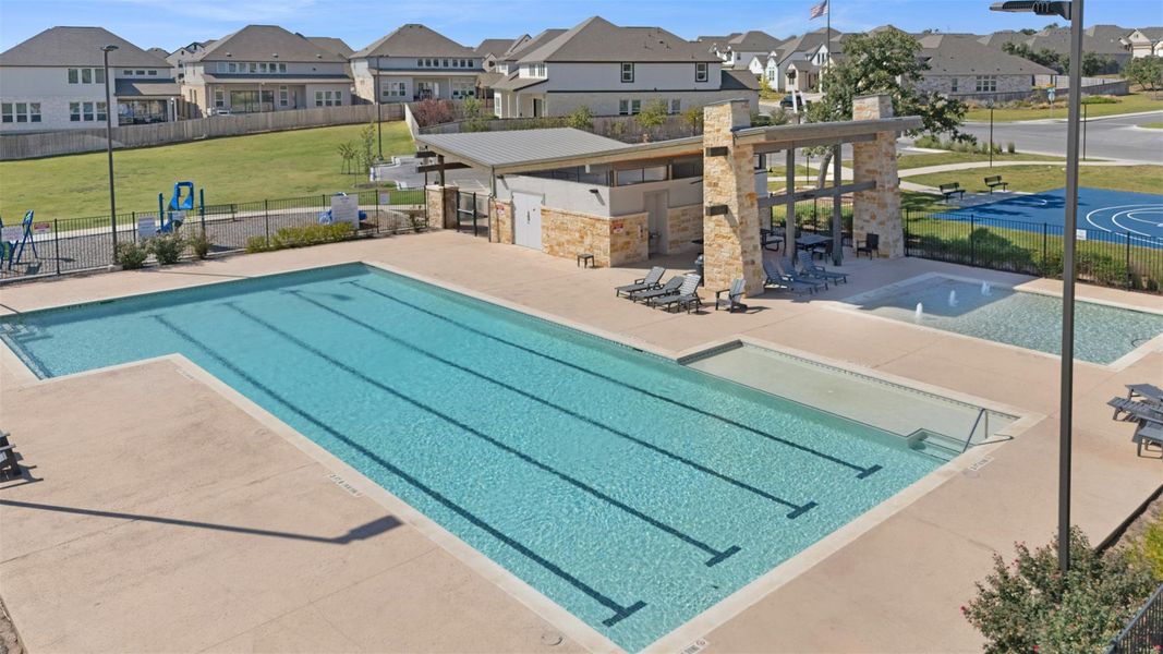 An inviting community aquatic area features a pristine lap pool and a relaxing splash pad. An inviting community aquatic area features a pristine lap pool and a relaxing splash pad.