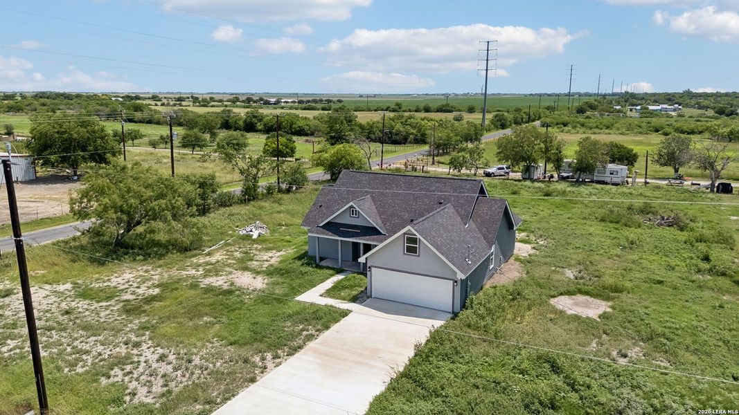 Front exterior of a new home in , Natalia, TX, highlighting curb appeal (Image 19).