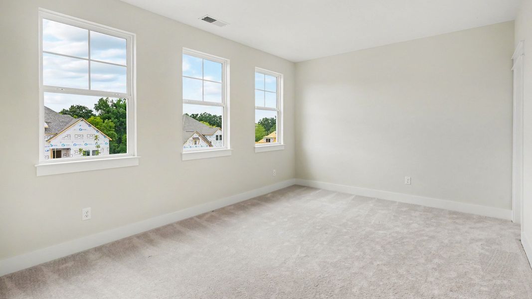 Secondary bathroom with carpet and windows Secondary bathroom with carpet and windows