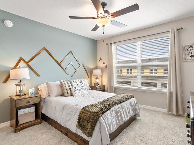 Spacious secondary bedrooms are roomy enough for a queen sized bed - Mariposa townhome by Highland Homes