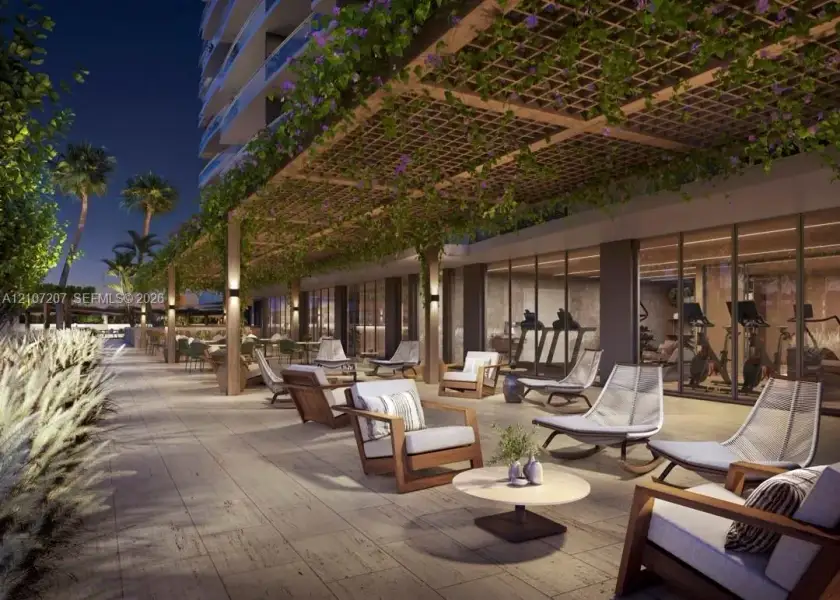 Covered outdoor patio featuring an overhead pergola with integrated landscape climbing vines, stone-tiled flooring, and recessed wall-mounted lighting Covered outdoor patio featuring an overhead pergola with integrated landscape climbing vines, stone-tiled flooring, and recessed wall-mounted lighting