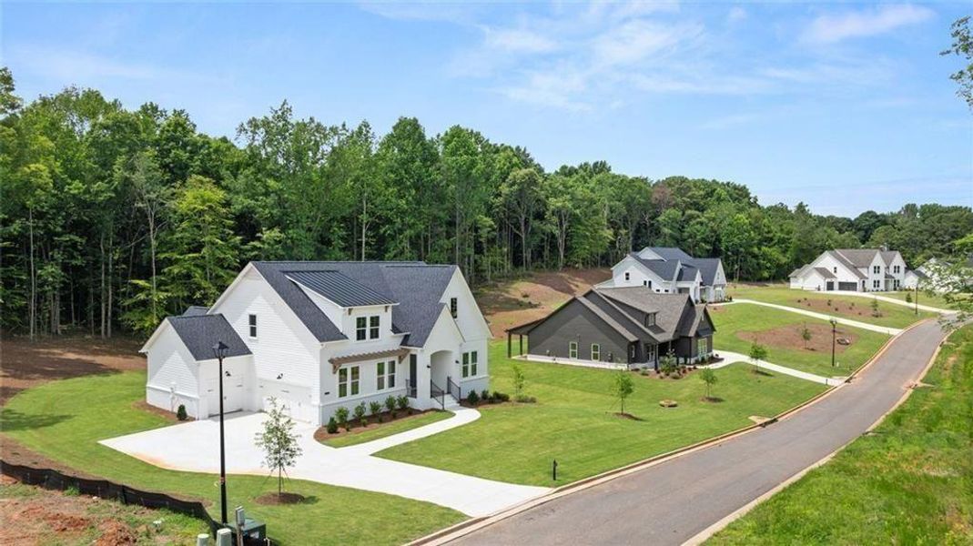Front exterior of a new home in , Gainesville, GA, highlighting curb appeal (Image 27).