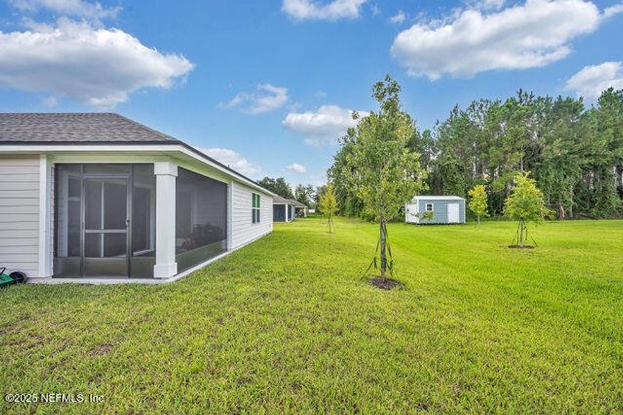Front exterior of a new home in Edinburgh Village, Jacksonville, FL, highlighting curb appeal (Image 20). Front exterior of a new home in Edinburgh Village, Jacksonville, FL, highlighting curb appeal (Image 20).