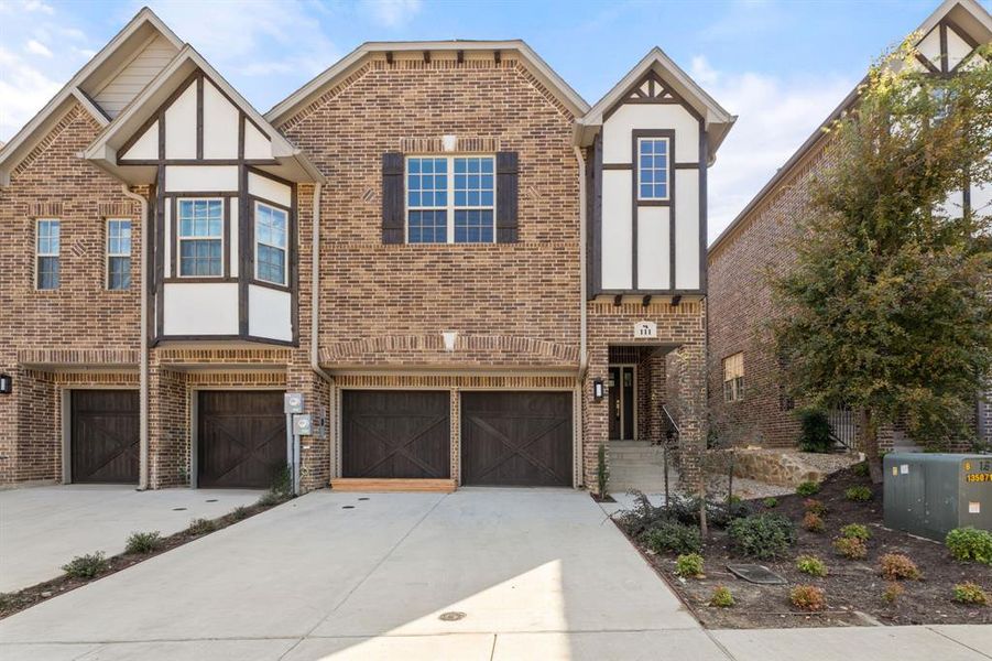 Tudor house featuring a garage