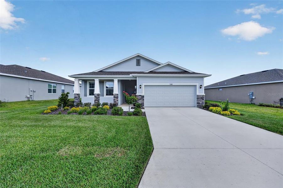 Front exterior of a new home in JB Ranch, Ocala, FL, highlighting curb appeal (Image 22).