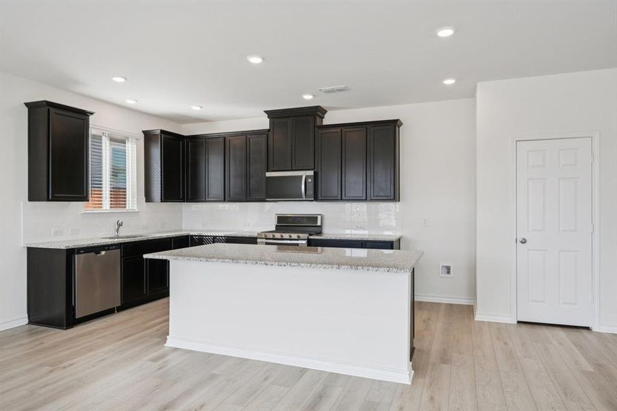 Furnished interior view inside a new home in Heartland Signature, Crandall (Image 10).