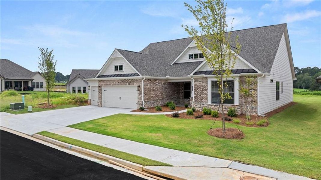 Front exterior of a new home in Soleil Summit Chase, Snellville, GA, highlighting curb appeal (Image 24). Front exterior of a new home in Soleil Summit Chase, Snellville, GA, highlighting curb appeal (Image 24).