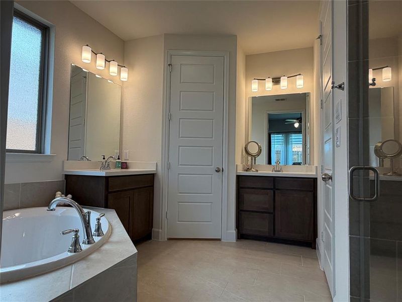 with Twin Vanities, A Separate Soaking Tub and Shower with Twin Vanities, A Separate Soaking Tub and Shower