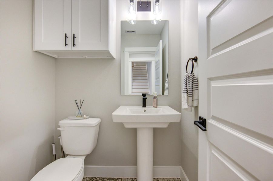 Spacious half bath with storage.