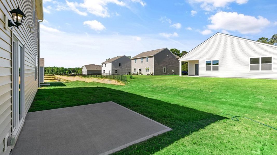 Exterior details and patio area of a home in East Ridge, Ayden (Image 20).