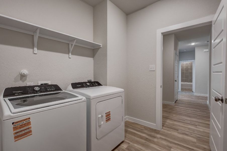 A kitchen with a washer and dryer. A kitchen with a washer and dryer.