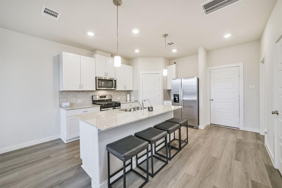 The island is a great place for additional high chair seating. The island is a great place for additional high chair seating.