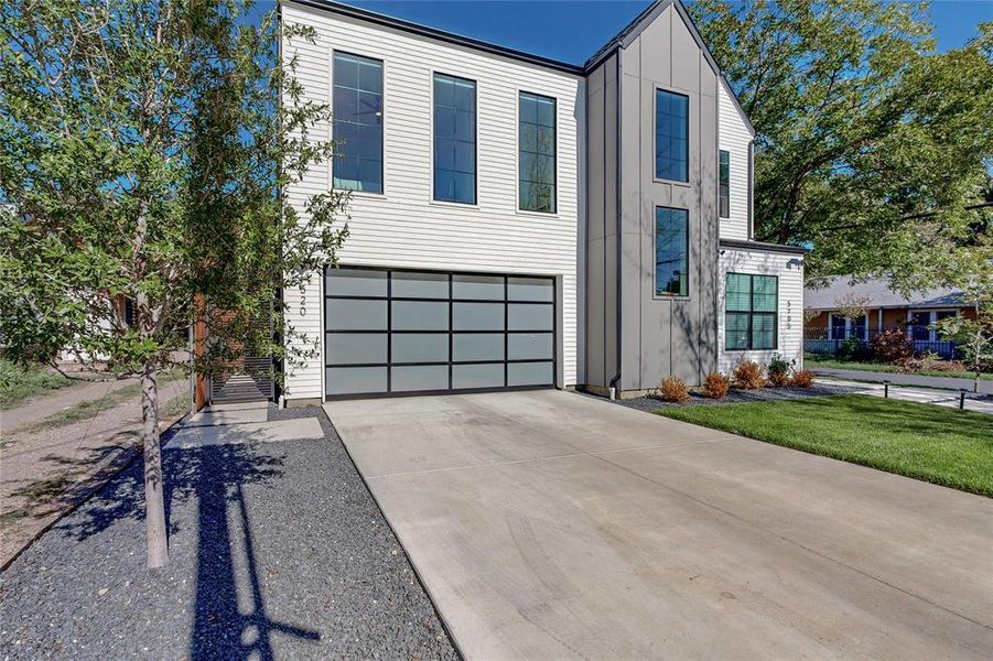 View of front of property featuring a garage