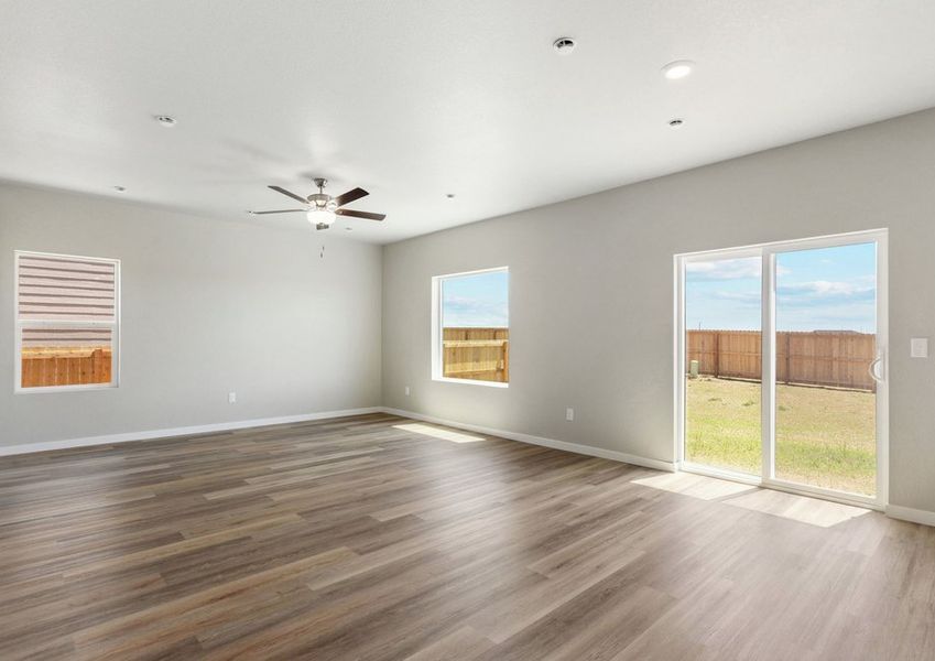 The family room is spacious with a ceiling fan