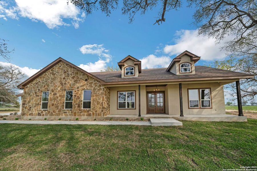Front exterior of a new home in , Floresville, TX, highlighting curb appeal (Image 21). Front exterior of a new home in , Floresville, TX, highlighting curb appeal (Image 21).