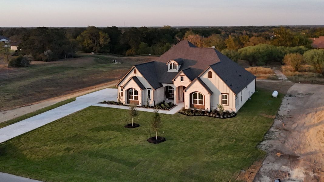 Exterior details and patio area of a home in Windmill Hill, Bryan (Image 4).