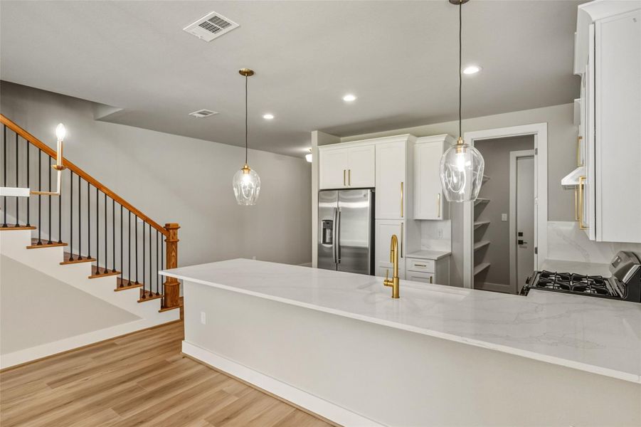 Discover a sleek bar area perfect for entertaining, with ample space for barstools and stylish lighting to set the mood. Discover a sleek bar area perfect for entertaining, with ample space for barstools and stylish lighting to set the mood.