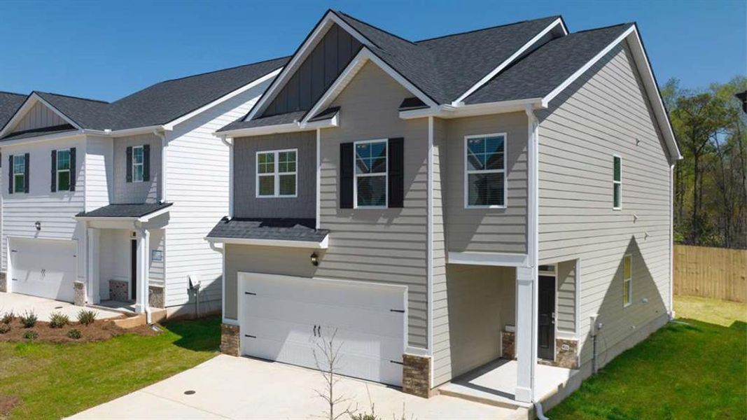 Front exterior of a new home in Shoal Creek, Hampton, GA, highlighting curb appeal (Image 17).