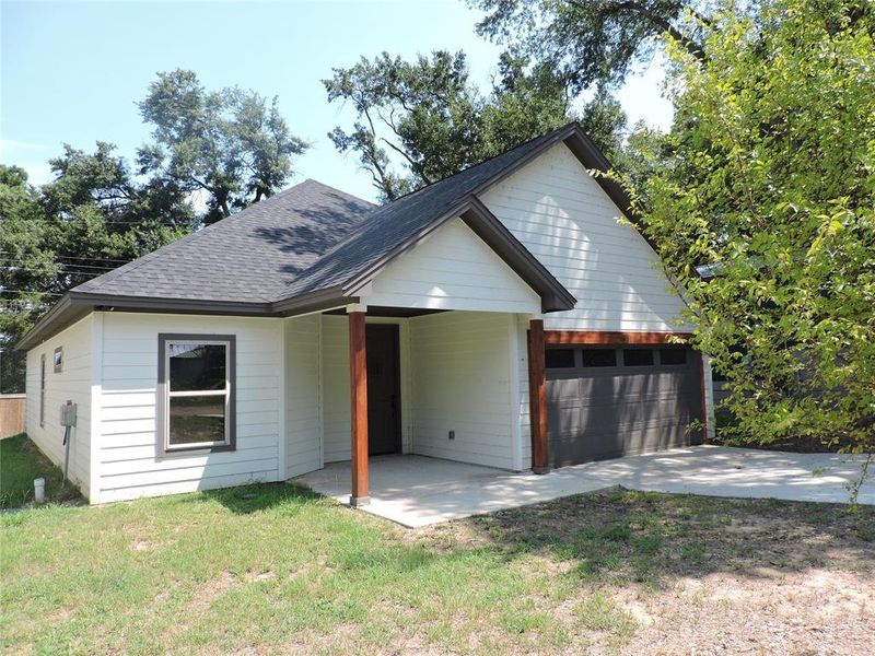 Front exterior of a new home in , Gun Barrel City, TX, highlighting curb appeal (Image 1). Front exterior of a new home in , Gun Barrel City, TX, highlighting curb appeal (Image 1).