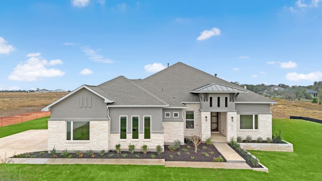 Front exterior of a new home in Leander Estates, Leander, TX, highlighting curb appeal (Image 2). Front exterior of a new home in Leander Estates, Leander, TX, highlighting curb appeal (Image 2).