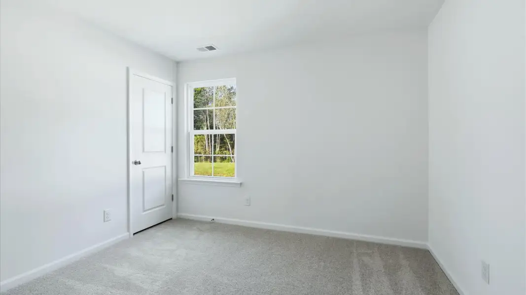 Bedroom 3 in the Pritchard is ideal for family, guests, or flex use