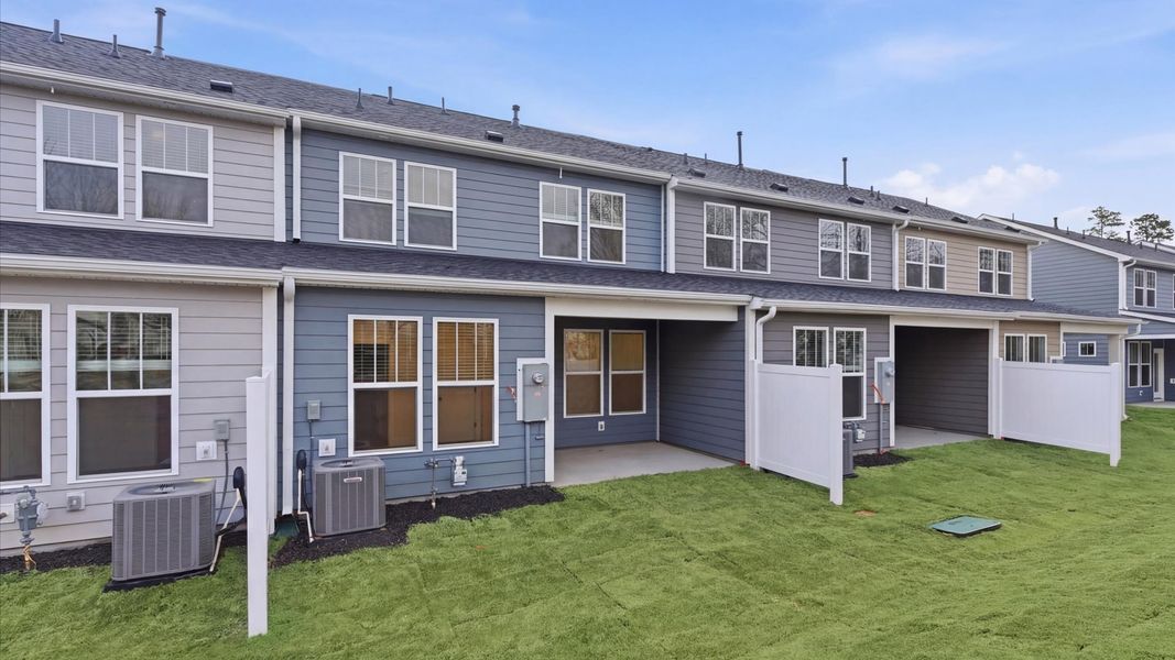 Exclusive rear covered porch with accomplished detail and elevated outdoor living potential at Pelham Crossing