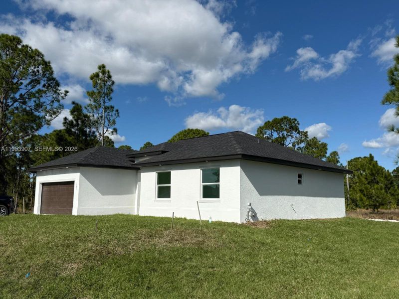 Exterior details and patio area of a home in , Lehigh Acres (Image 13). Exterior details and patio area of a home in , Lehigh Acres (Image 13).
