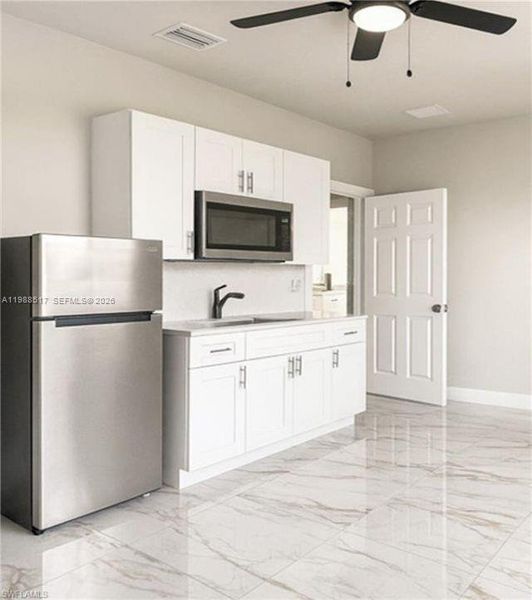 Furnished interior view inside a new home in , Lehigh Acres (Image 8).