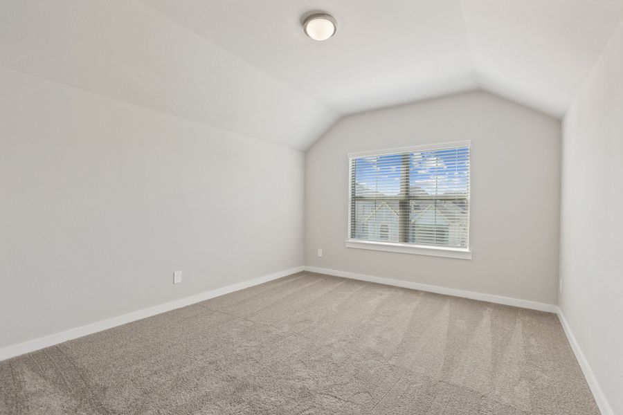 Bedroom in the Elm home plan by Trophy Signature Homes – REPRESENTATIVE PHOTO