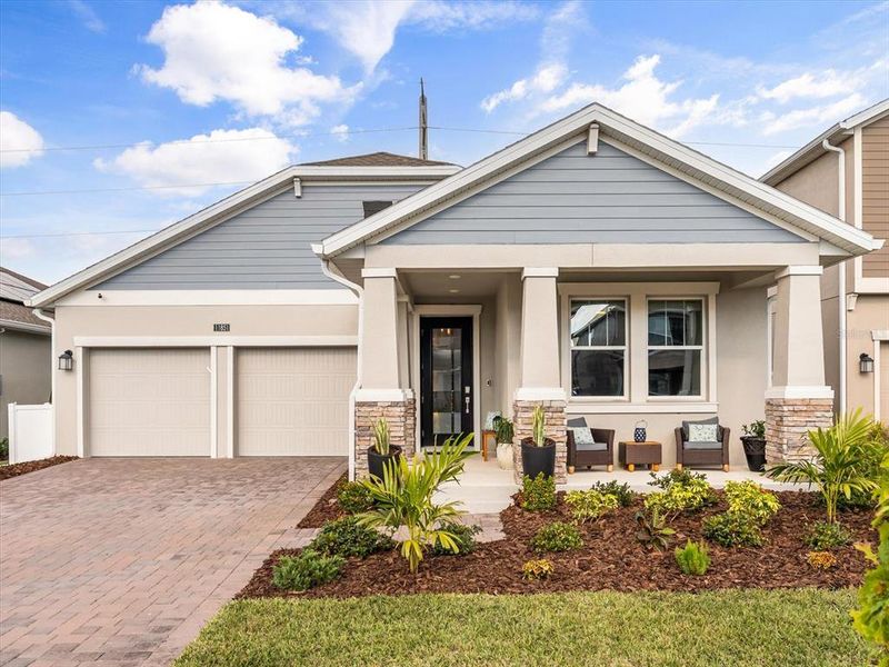Front exterior of a new home in , Orlando, FL, highlighting curb appeal (Image 1).