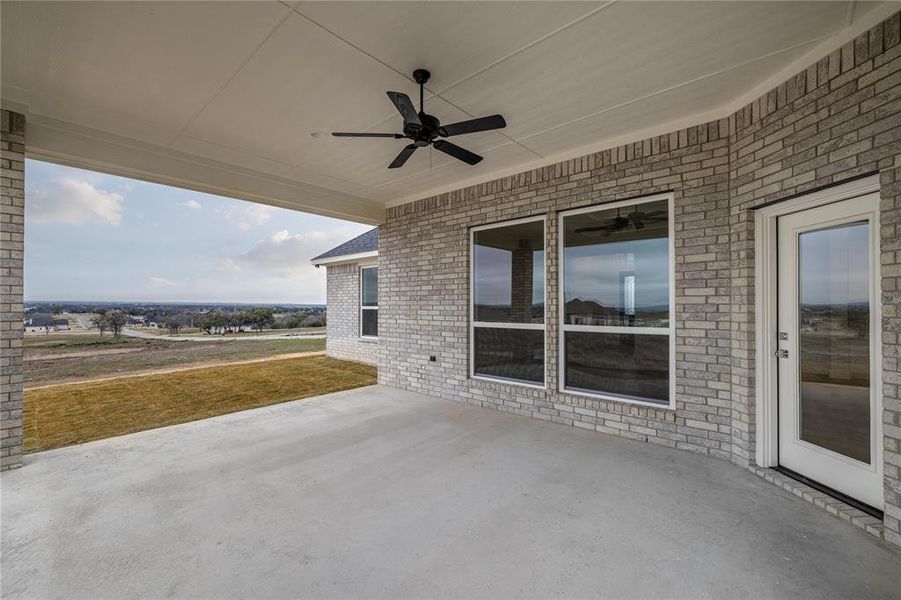 View of patio featuring ceiling fan