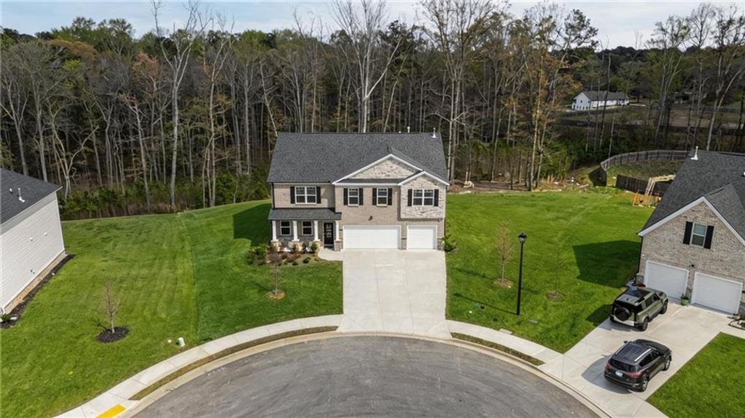 Front exterior of a new home in Independence, Loganville, GA, highlighting curb appeal (Image 20).