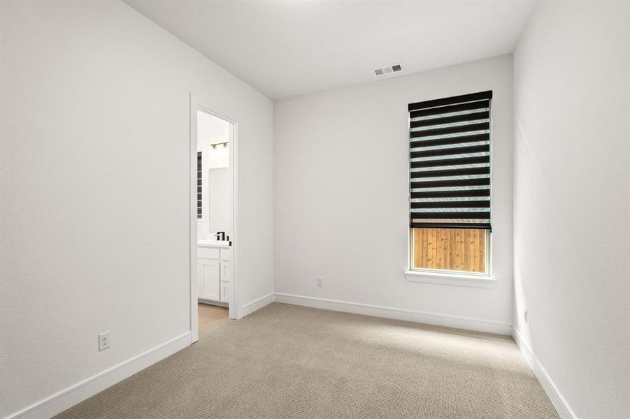 First floor guest bedroom with walk in closet and full private bath