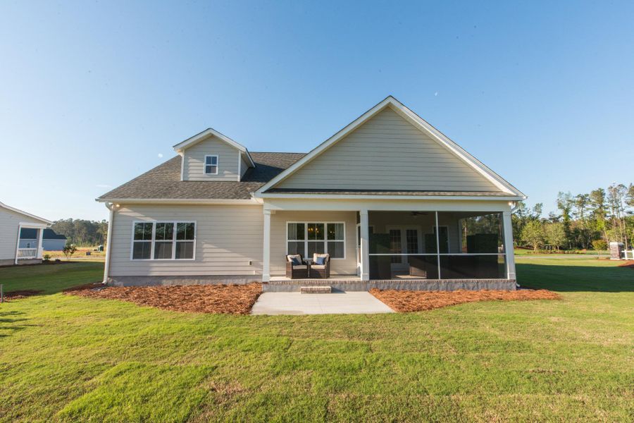 Representative exterior photo of a completed home built from the Helmsley by Bill Clark Homes in The Sanctuary at Sunset Beach, Sunset Beach, NC (Image 26). Representative exterior photo of a completed home built from the Helmsley by Bill Clark Homes in The Sanctuary at Sunset Beach, Sunset Beach, NC (Image 26).