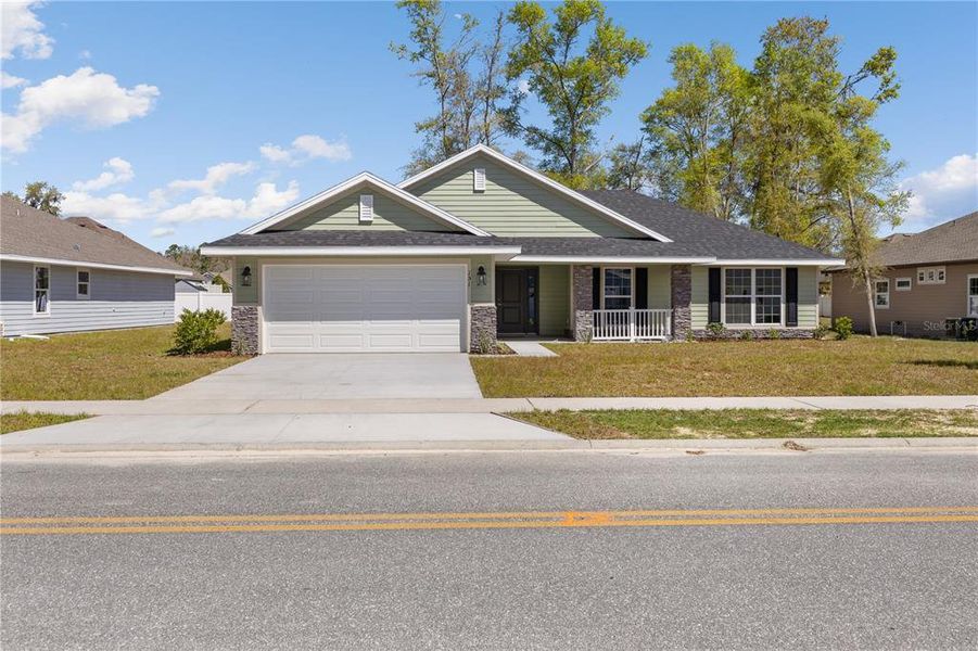 Front exterior of a new home in The Preserve at Laurel Lake, Lake City, FL, highlighting curb appeal (Image 14). Front exterior of a new home in The Preserve at Laurel Lake, Lake City, FL, highlighting curb appeal (Image 14).