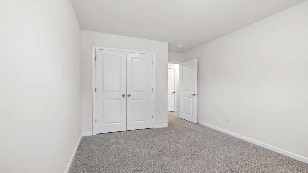 Spacious, unfurnished interior of a new home in Tanglewood Townes, Greenville (Image 24).