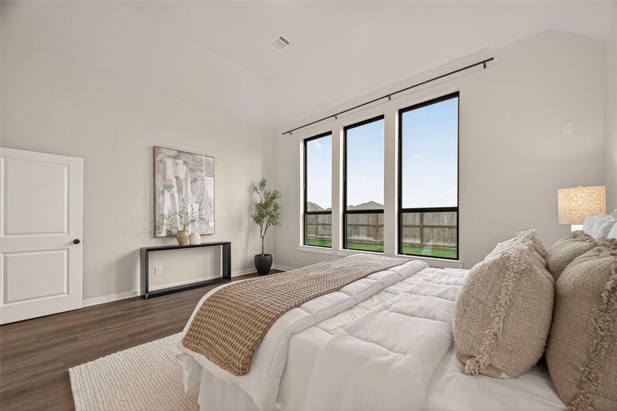 Magnificent primary bedroom, a true master retreat.