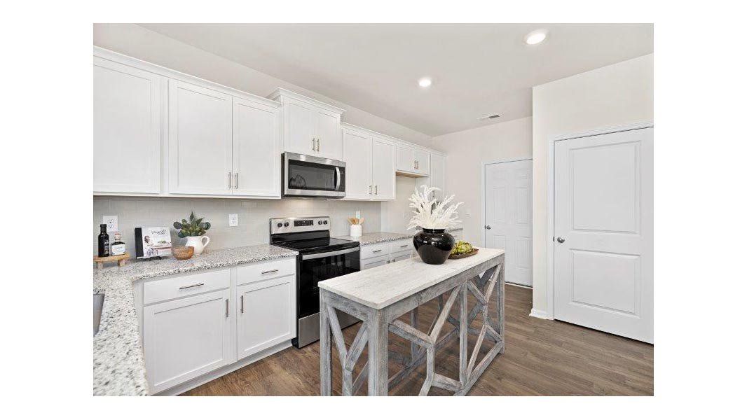 Representative furnished interior of a home built from the Taylor by D.R. Horton in Falls at Hickory, Hickory (Image 10).
