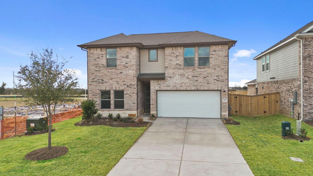 Front exterior of a new home in Windrose Green, Angleton, TX, highlighting curb appeal (Image 21).