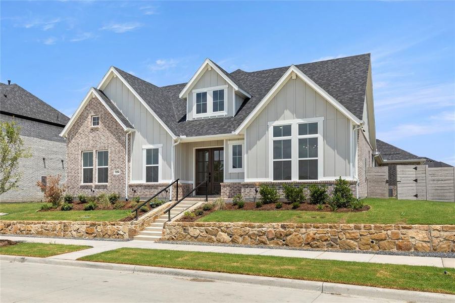 Front exterior of a new home in Painted Tree Showcase, McKinney, TX, highlighting curb appeal (Image 2).