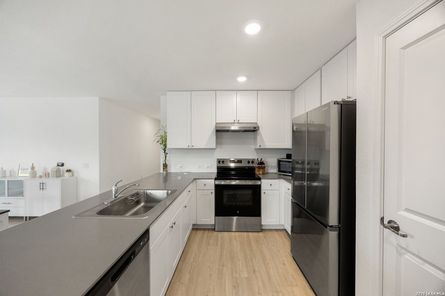Furnished interior view inside a new home in Mission del Lago, San Antonio (Image 17).