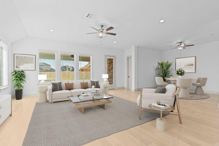 A well-organized living room that includes a kitchen and dining area, creating a warm and welcoming environment for gatherings. A well-organized living room that includes a kitchen and dining area, creating a warm and welcoming environment for gatherings.